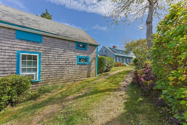 view of home's exterior featuring a lawn