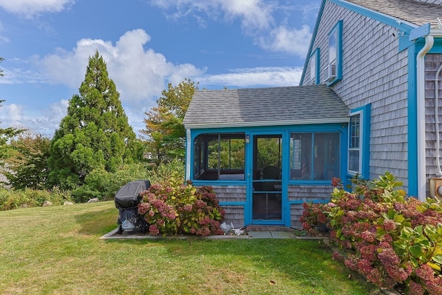 view of outbuilding with a yard