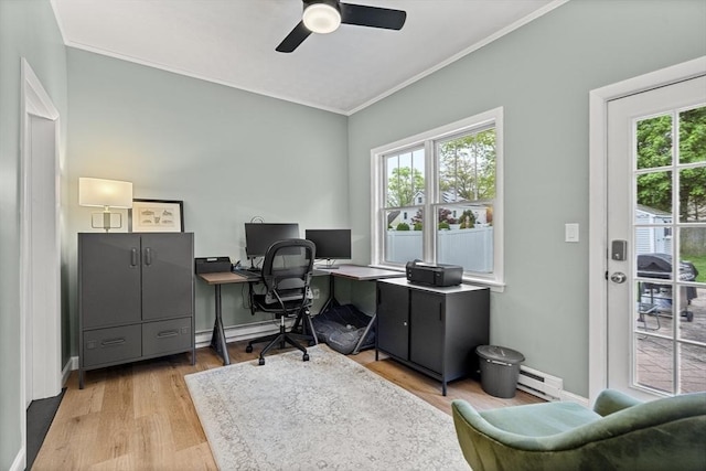 office featuring a baseboard heating unit, crown molding, healthy amount of natural light, a ceiling fan, and light wood-type flooring