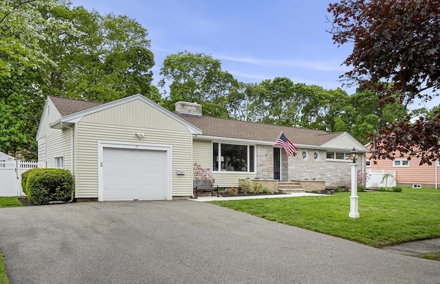 single story home featuring an attached garage, a chimney, driveway, and a shingled roof