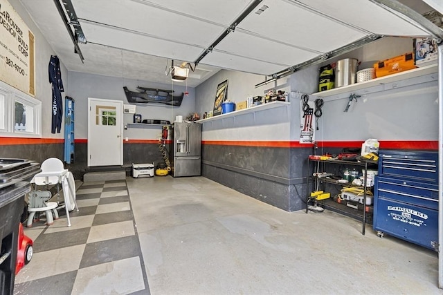 garage with a garage door opener and high end refrigerator