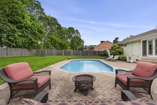 view of swimming pool featuring french doors, a patio area, and a fire pit