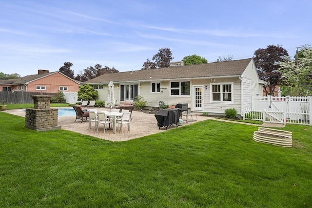 back of house with a patio and a gate
