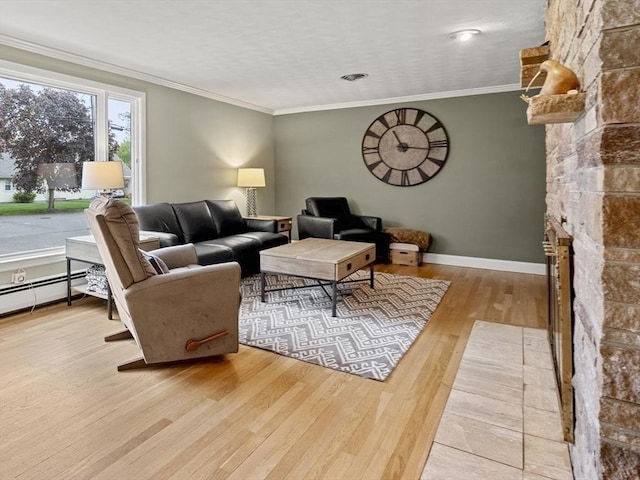 living area featuring wood finished floors, a fireplace, crown molding, baseboards, and baseboard heating