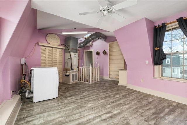 additional living space featuring light hardwood / wood-style flooring and ceiling fan