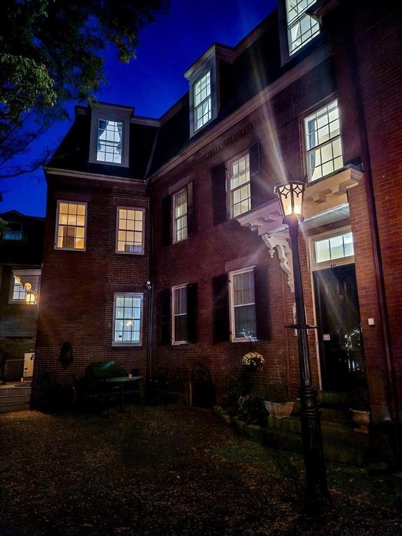 view of back house at night