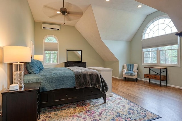 3 Alcorn Rd, Chelmsford, MA 01824 - bedroom with an AC wall unit, wood finished floors, baseboards, vaulted ceiling, and recessed lighting