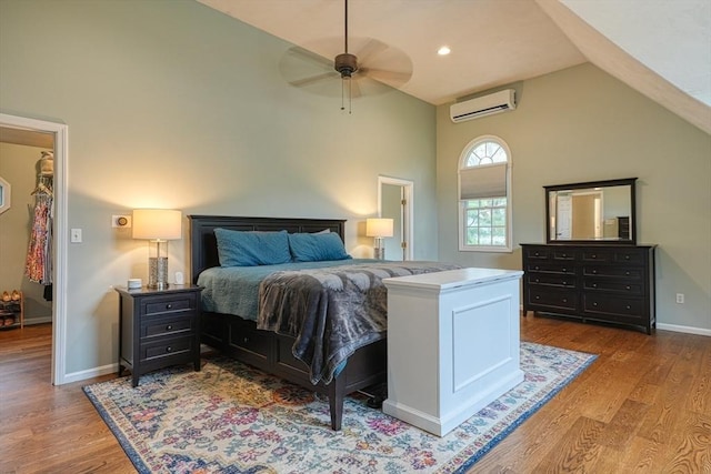 3 Alcorn Rd, Chelmsford, MA 01824 - bedroom with a wall unit AC, wood finished floors, baseboards, high vaulted ceiling, and ceiling fan