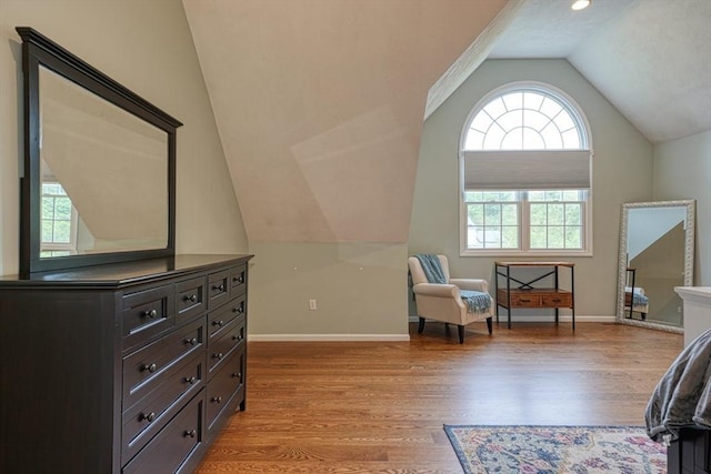 3 Alcorn Rd, Chelmsford, MA 01824 - living area with lofted ceiling, light wood-style floors, healthy amount of natural light, and baseboards
