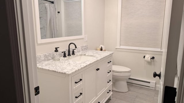 3 Alcorn Rd, Chelmsford, MA 01824 - bathroom featuring a baseboard radiator, toilet, and vanity