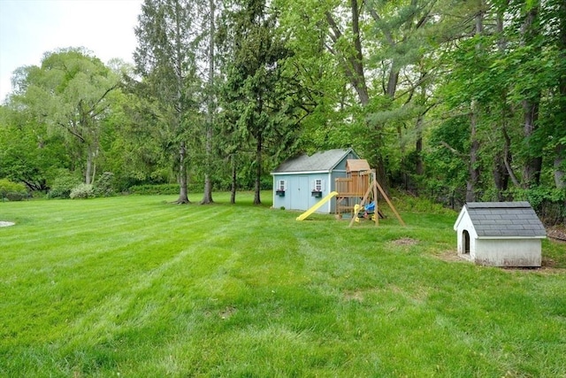3 Alcorn Rd, Chelmsford, MA 01824 - view of grassy yard featuring a playground
