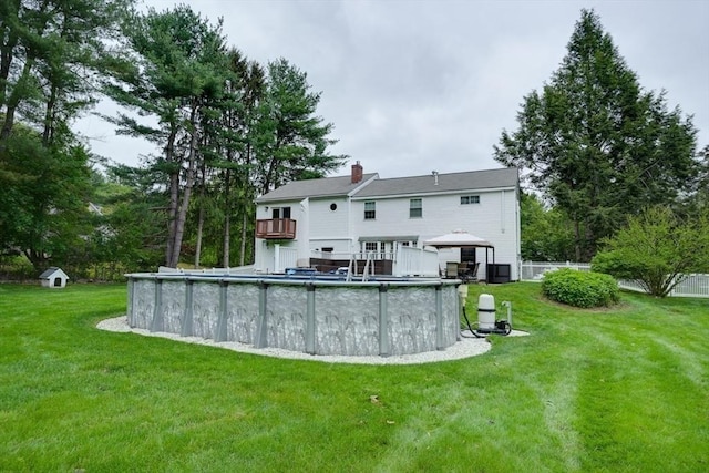 3 Alcorn Rd, Chelmsford, MA 01824 - back of property featuring a gazebo, a yard, a chimney, an outdoor pool, and central AC unit