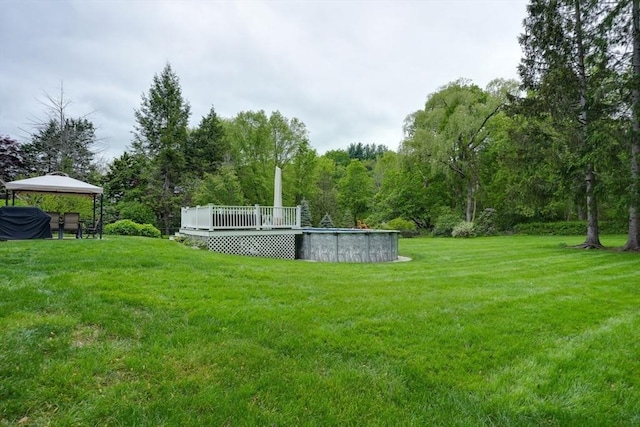 3 Alcorn Rd, Chelmsford, MA 01824 - view of grassy yard featuring a wooden deck, an outdoor pool, and a gazebo