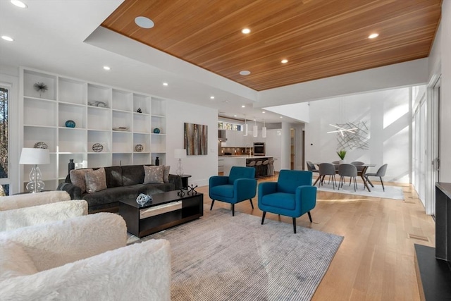 living room featuring wooden ceiling and light wood-type flooring