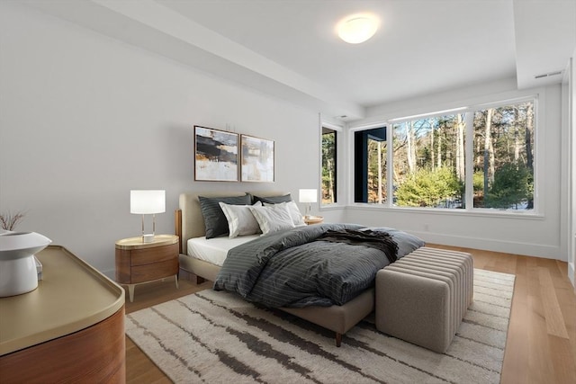 bedroom featuring wood-type flooring