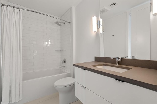 full bathroom with vanity, toilet, tile patterned flooring, and shower / tub combo