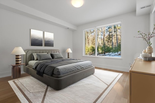 bedroom with light hardwood / wood-style flooring