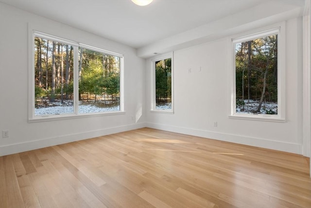 unfurnished room with light hardwood / wood-style flooring