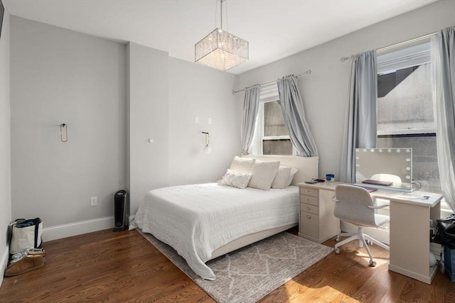 338 Meridian St Unit 2, Boston, MA 02128 - bedroom featuring a chandelier, wood finished floors, and a desk