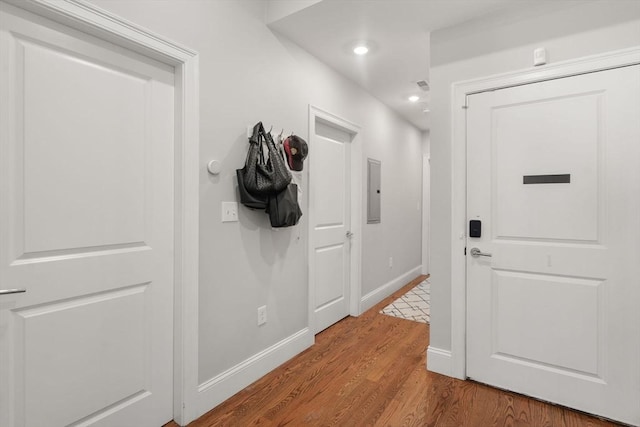 338 Meridian St Unit 2, Boston, MA 02128 - corridor with wood finished floors, electric panel, and recessed lighting