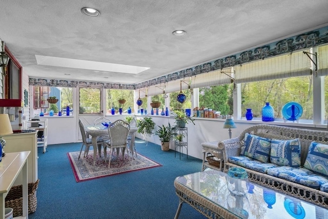 sunroom / solarium featuring a skylight