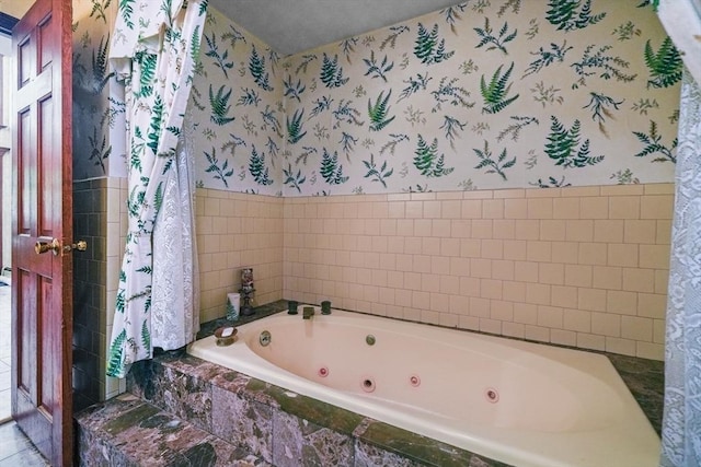 bathroom featuring tiled bath