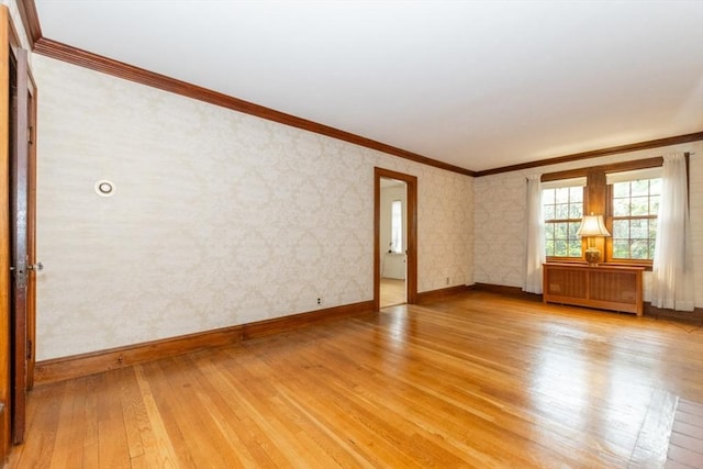 504 Mount Auburn St, Watertown, MA 02472 - unfurnished room with light wood-style flooring, radiator heating unit, and crown molding