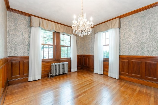 504 Mount Auburn St, Watertown, MA 02472 - spare room with radiator heating unit, wainscoting, hardwood / wood-style floors, a chandelier, and crown molding