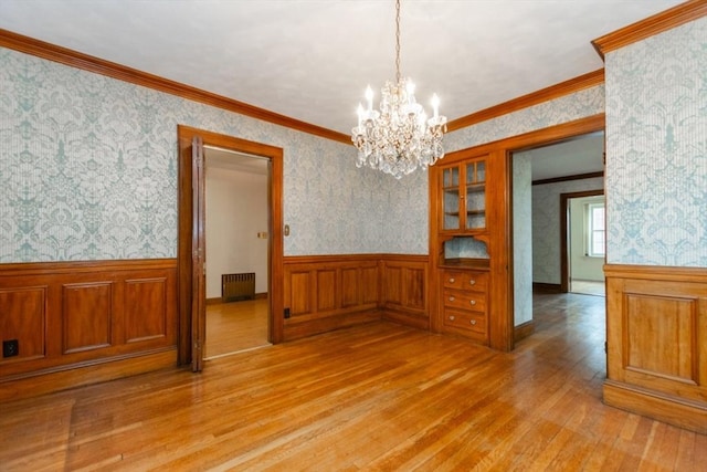 504 Mount Auburn St, Watertown, MA 02472 - unfurnished dining area featuring light wood-style floors, radiator heating unit, a wainscoted wall, a chandelier, and wallpapered walls