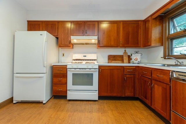 504 Mount Auburn St, Watertown, MA 02472 - kitchen featuring white appliances, under cabinet range hood, light countertops, and brown cabinetry