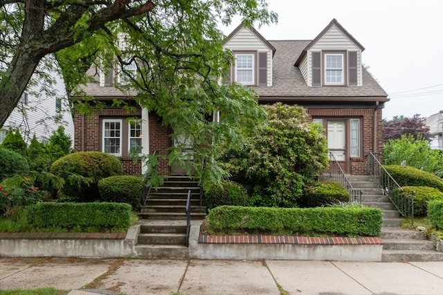 504 Mount Auburn St, Watertown, MA 02472 - view of front of house featuring brick siding, stairway, and a shingled roof
