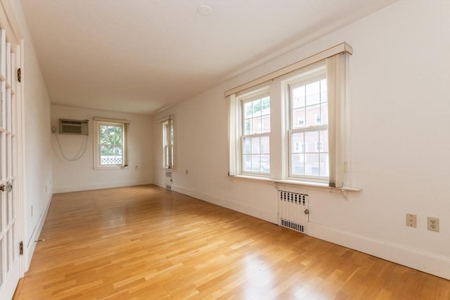 504 Mount Auburn St, Watertown, MA 02472 - empty room with radiator and light wood-type flooring