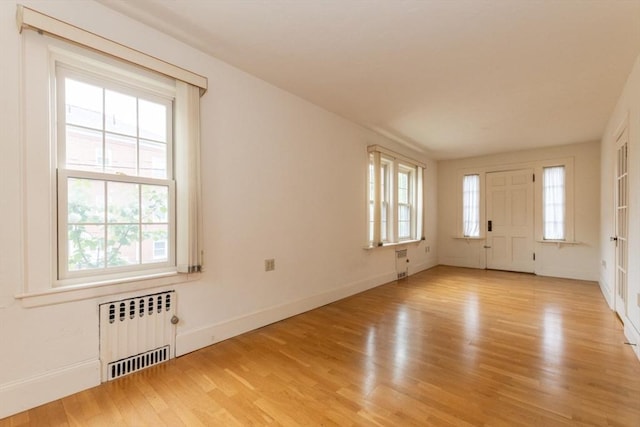 504 Mount Auburn St, Watertown, MA 02472 - entrance foyer featuring radiator and wood finished floors