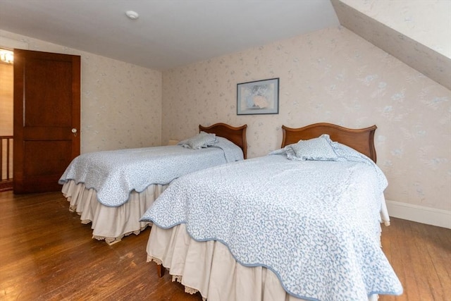 504 Mount Auburn St, Watertown, MA 02472 - bedroom with wood finished floors, lofted ceiling, and wallpapered walls