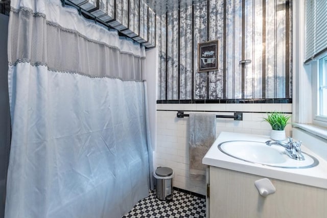 504 Mount Auburn St, Watertown, MA 02472 - full bathroom featuring vanity, tile walls, a wainscoted wall, a shower with shower curtain, and tile patterned floors