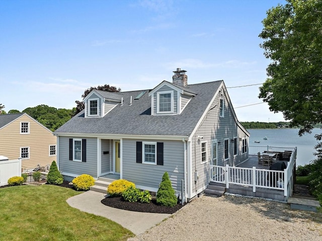 77 Jefferson Shores Rd, Wareham, MA 02532 - new england style home featuring a shingled roof, a front yard, a chimney, and a deck with water view