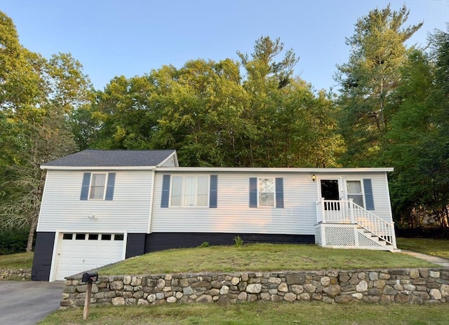 96 Harris St, Methuen, MA 01844 - view of front facade with a garage, a front yard, and asphalt driveway