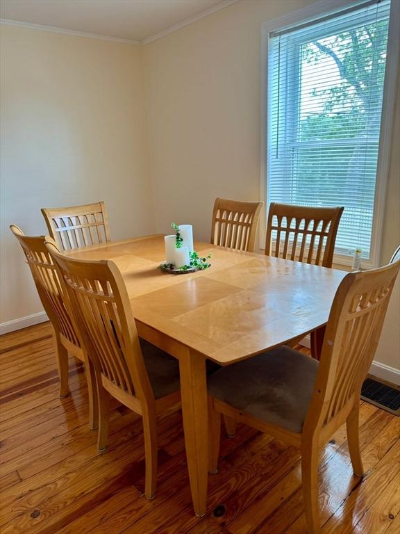 96 Harris St, Methuen, MA 01844 - dining area featuring healthy amount of natural light, light wood-type flooring, and ornamental molding