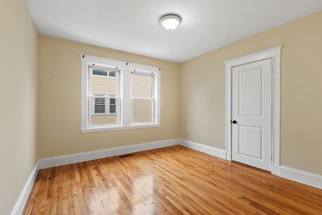 spare room featuring light hardwood / wood-style flooring