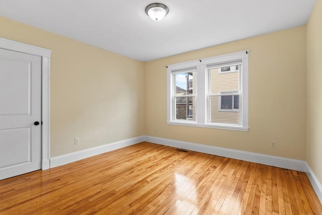 spare room featuring light hardwood / wood-style floors