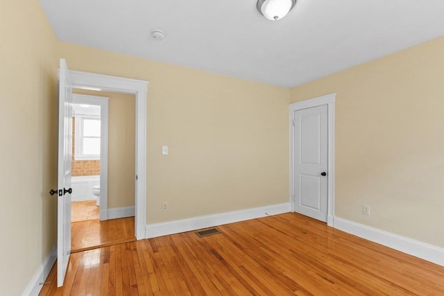 spare room featuring light hardwood / wood-style floors