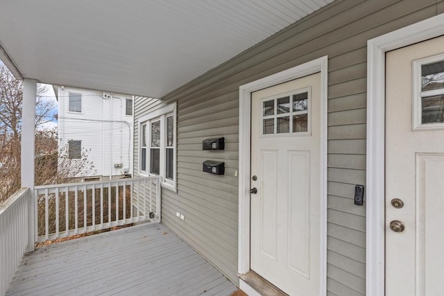 wooden terrace featuring covered porch