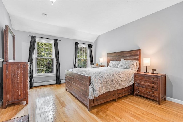 31 Alexander Rd, Hopkinton, MA 01748 - bedroom featuring light wood-style flooring, a baseboard heating unit, vaulted ceiling, and baseboards