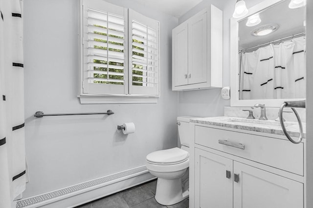 31 Alexander Rd, Hopkinton, MA 01748 - full bath featuring vanity, toilet, tile patterned flooring, and baseboard heating