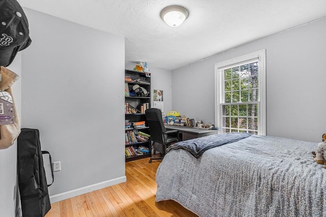 31 Alexander Rd, Hopkinton, MA 01748 - bedroom with hardwood / wood-style flooring and baseboards