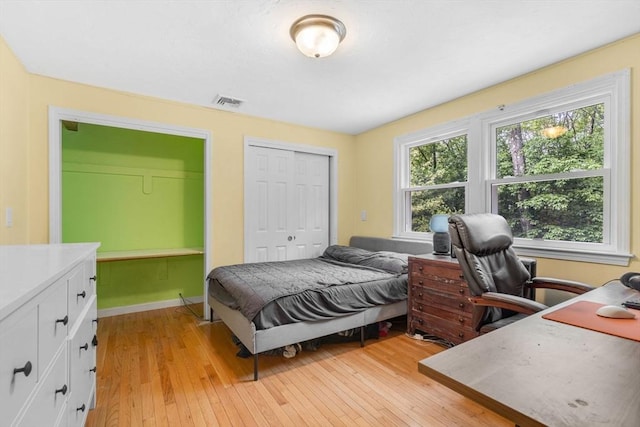 31 Alexander Rd, Hopkinton, MA 01748 - bedroom featuring light wood-type flooring, an office area, and a closet