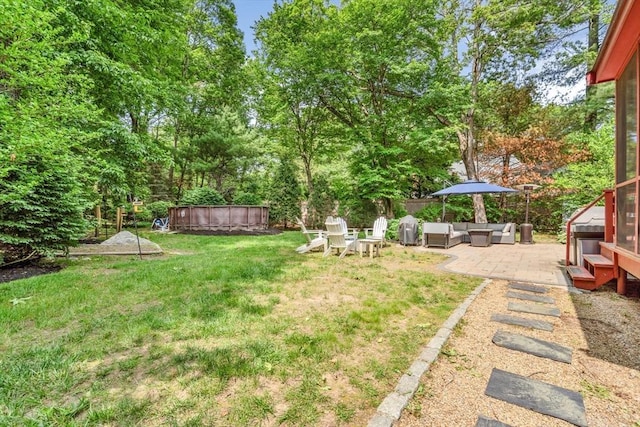31 Alexander Rd, Hopkinton, MA 01748 - view of green lawn featuring an outdoor hangout area, a jacuzzi, a patio area, and view of scattered trees