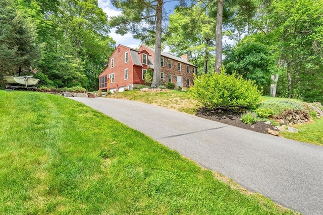 31 Alexander Rd, Hopkinton, MA 01748 - view of front of home with a chimney and a front yard