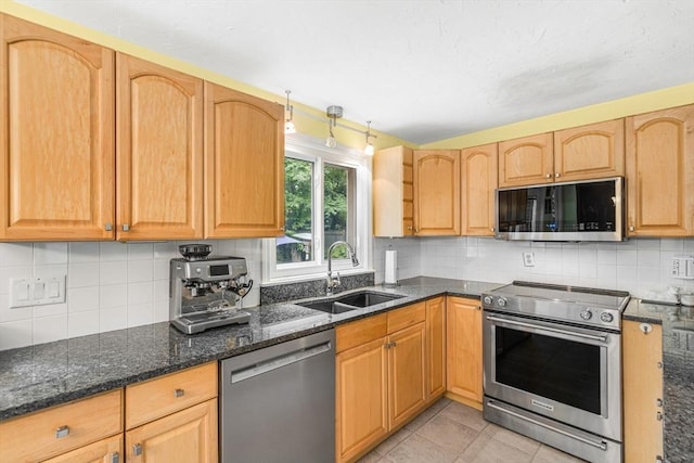 31 Alexander Rd, Hopkinton, MA 01748 - kitchen with appliances with stainless steel finishes, a sink, dark stone counters, and decorative backsplash