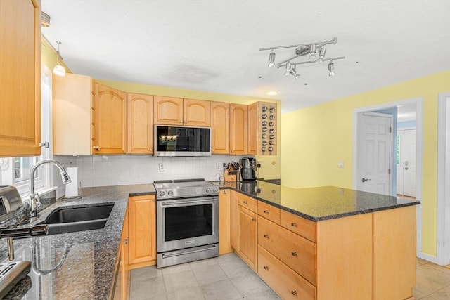 31 Alexander Rd, Hopkinton, MA 01748 - kitchen featuring appliances with stainless steel finishes, a sink, a peninsula, backsplash, and light brown cabinetry